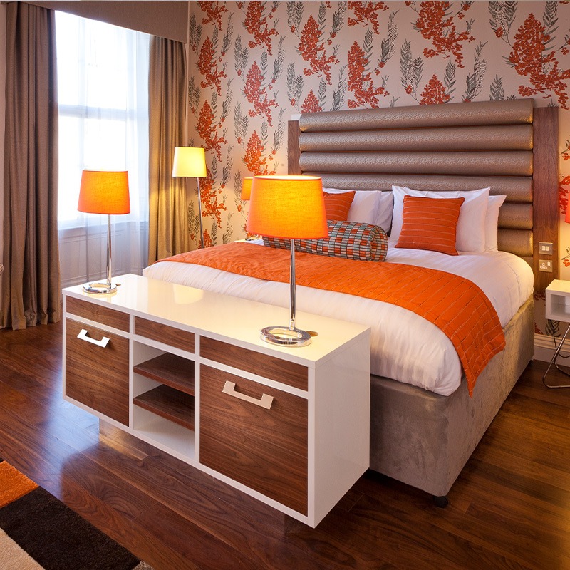 King Bed Standard Room Orange with floral wallpaper