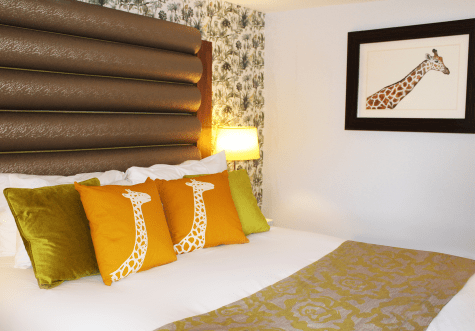 Room with yellow giraffe decor.